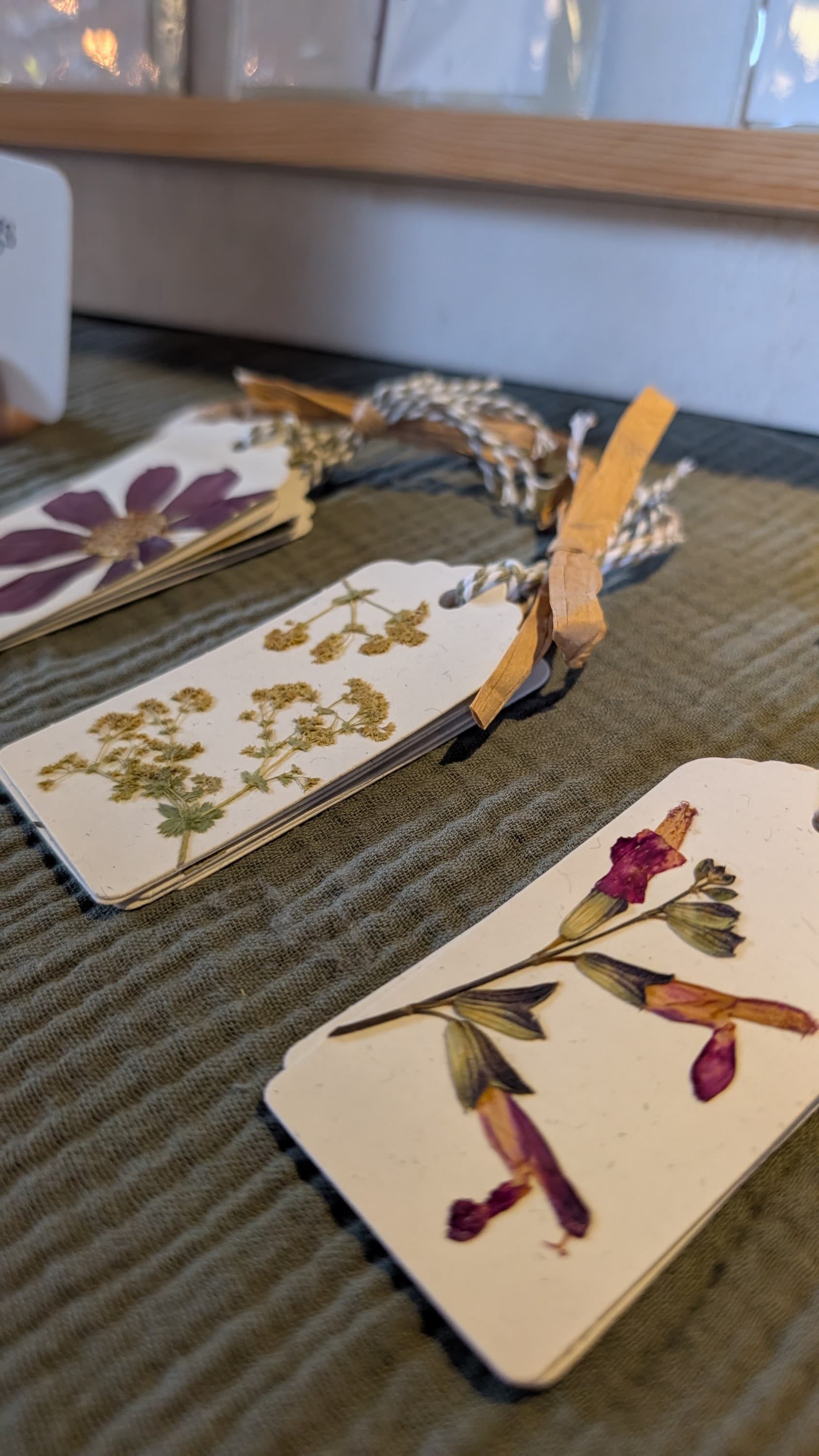 Floral market stall showcasing pressed botanical artwork